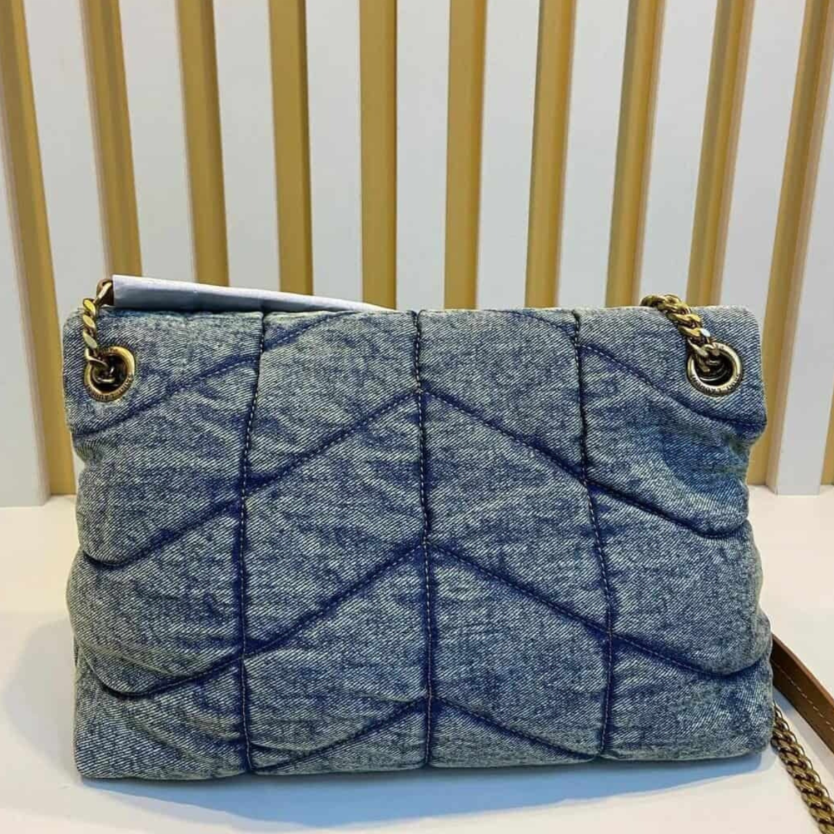 LOULOU PUFFER BAG IN QUILTED VINTAGE DENIM